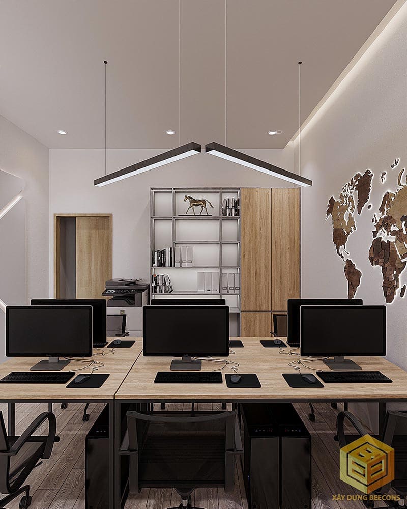 Bàn làm việc dài với ghế xoay tiện dụng, cùng với hệ thống máy tính được bố trí khoa học, giúp nhân viên dễ dàng trao đổi ý tưởng và hợp tác trong công việc.